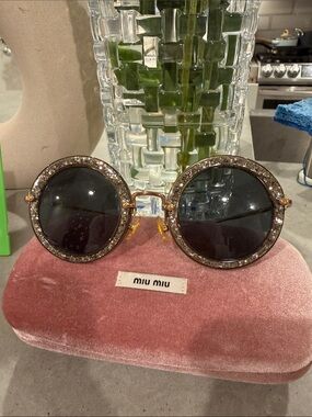 Miu Miu Black Lens Round Sunglasses with Gold-Tone Crystal Rim